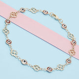 Oro Laminado Fancy Anklet, Gold Filled Style Evil Eye and Four-leaf Clover Design, Red Resin Finish, Golden Finish