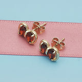 Oro Laminado Stud Earring, Gold Filled Style Bow Design, with Garnet Cubic Zirconia, Polished, Golden Finish
