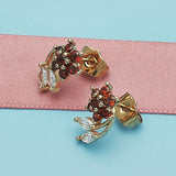 Oro Laminado Stud Earring, Gold Filled Style Flower and Leaf Design, with Garnet and White Cubic Zirconia, Polished, Golden Finish